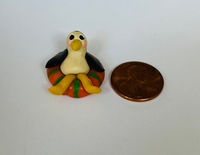 Mini Penguin Figurine in Life Preserver (1/2" tall)