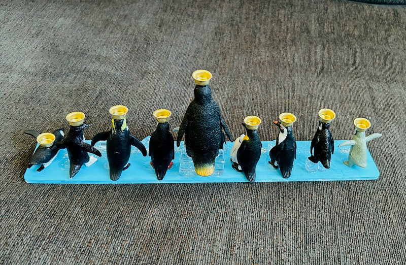 Penguin Hanukkah Menorah (12" x 2 1/2" x 4")